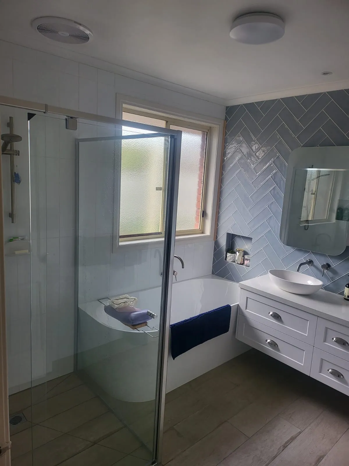 Full bathroom with bath, shower and vanity