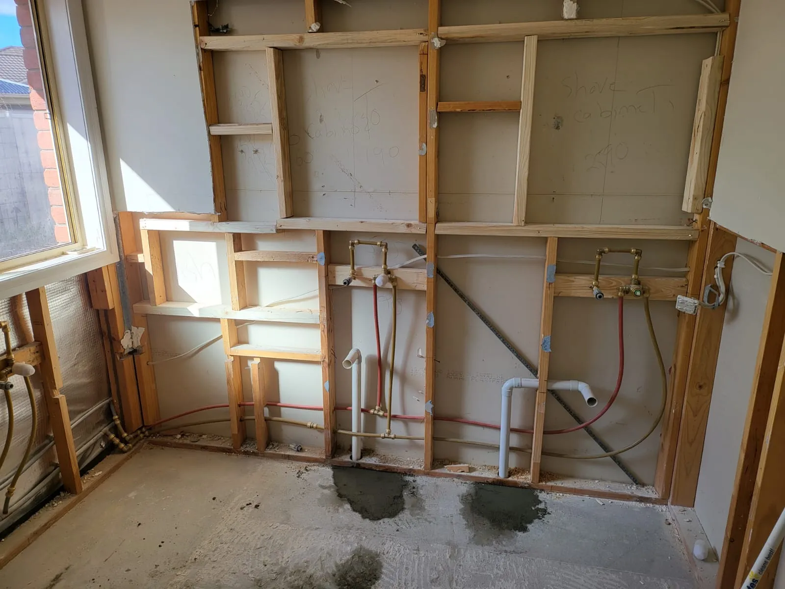 Stripped Keilor East bathroom showing exposed framing and plumbing rough-in