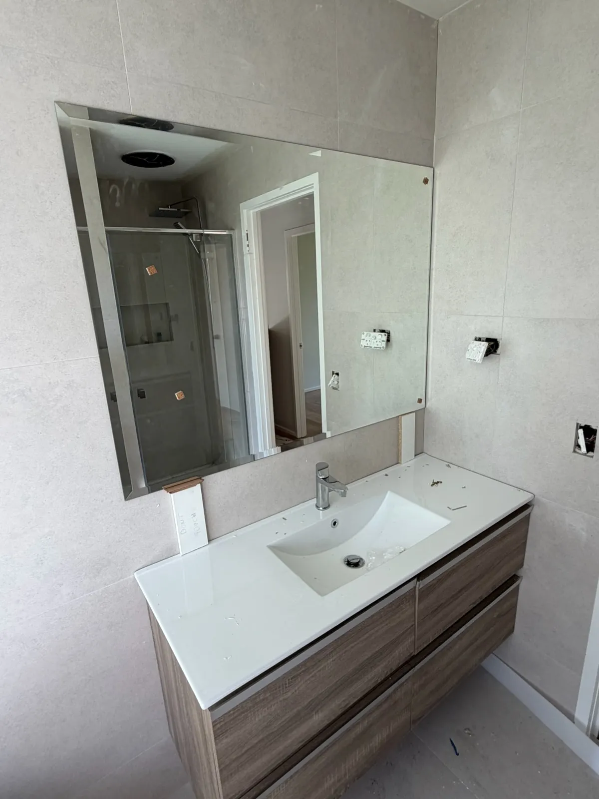 Belmont bathroom renovation with a wall-hung timber-look vanity, white integrated basin and large mirror