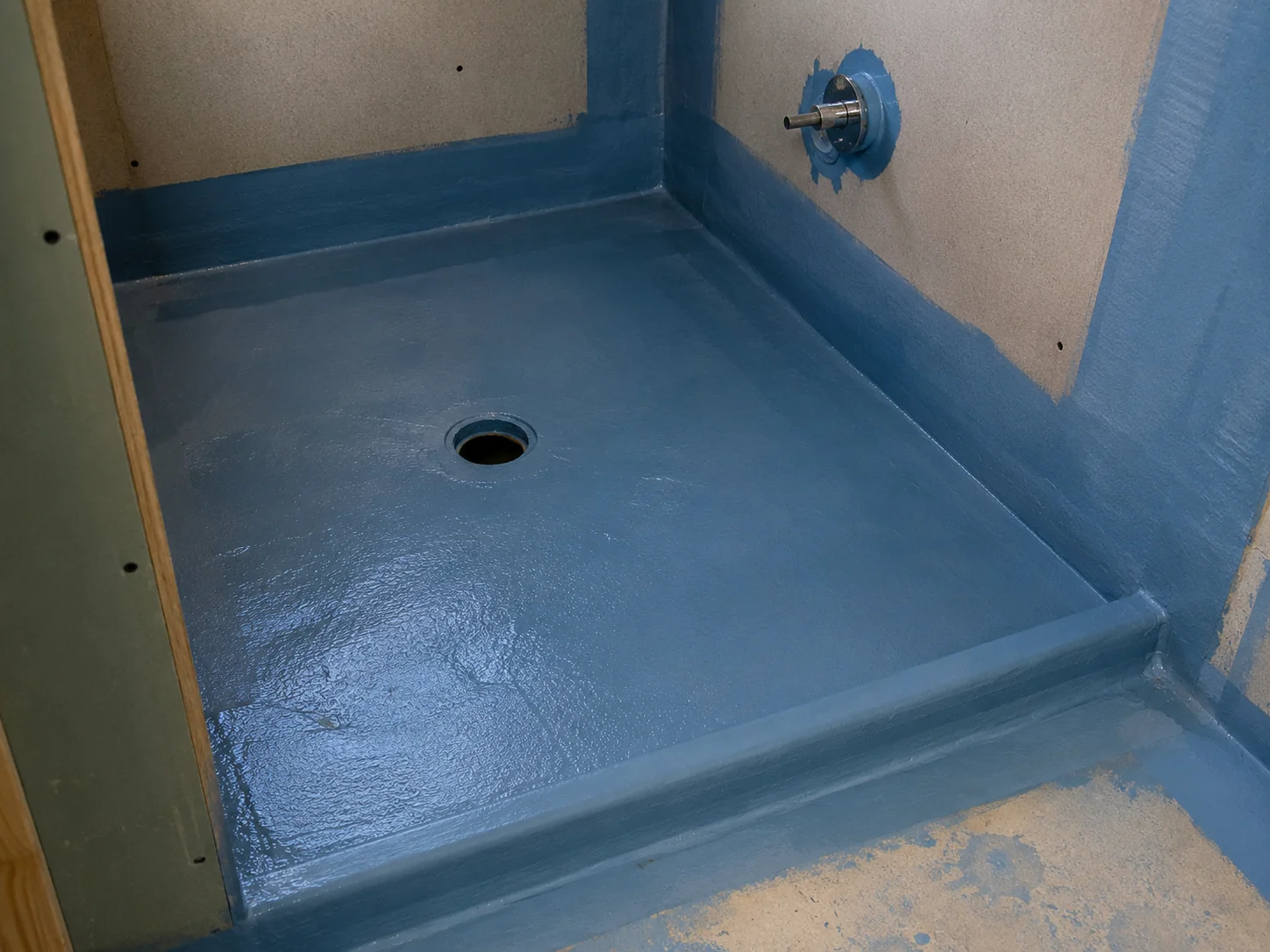 Waterproofing membrane applied around a shower base and wall junctions affecting cost in a Geelong bathroom