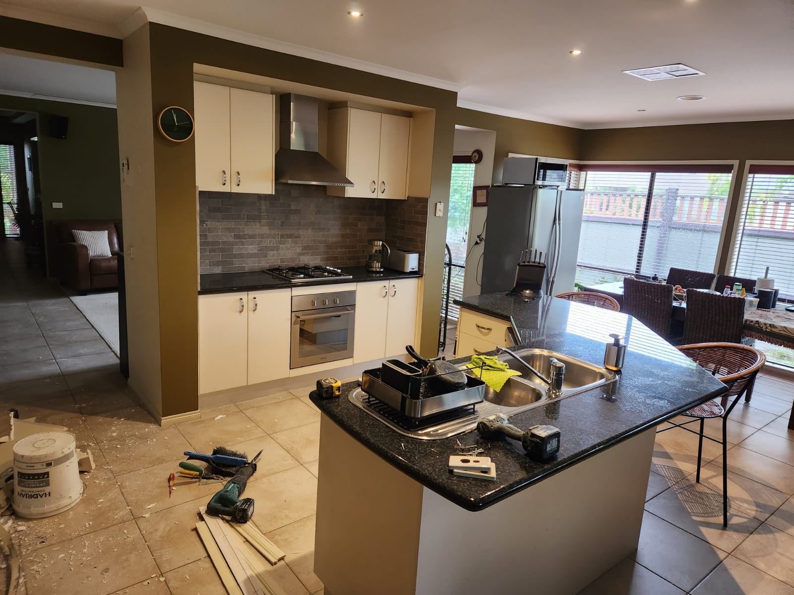 Old Point Cook kitchen before renovation, with cream cabinetry and closed-off layout