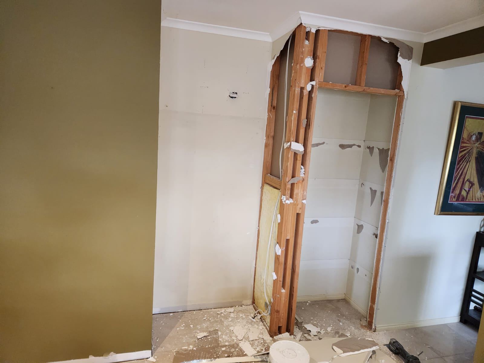 Wall opened up during demolition, exposing framing