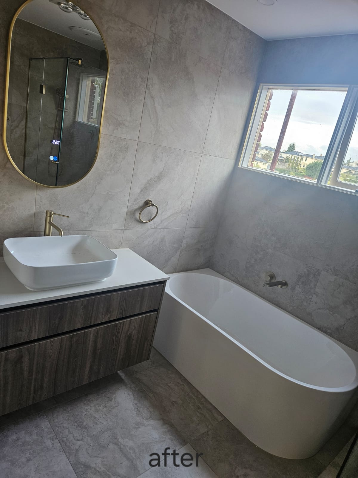 Finished Templestowe bathroom with freestanding bath, floating vanity and stone-look tile